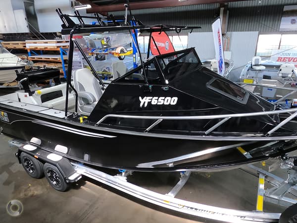 black small boat on a boat trailer ideal for fishing and other water activities